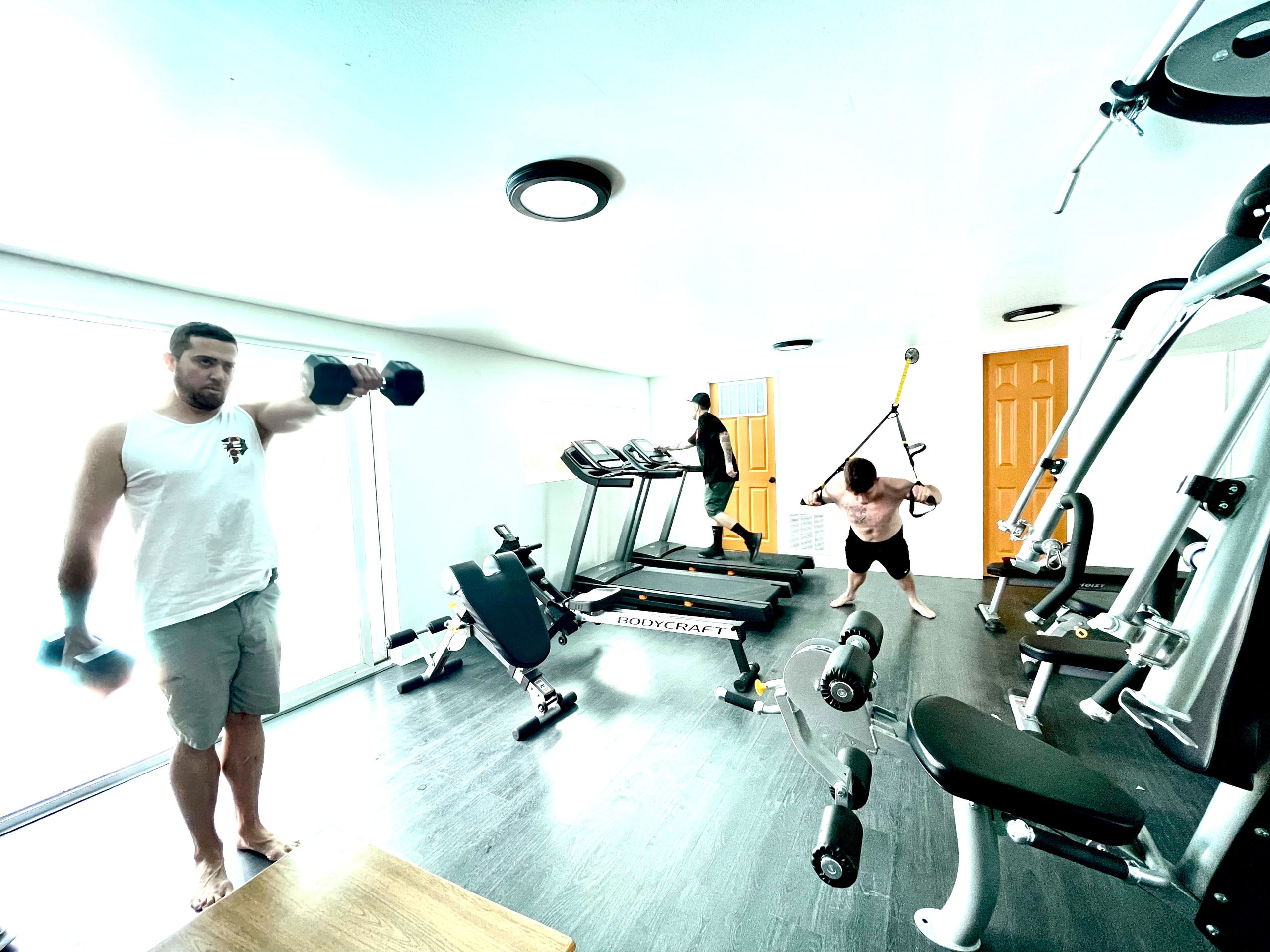 Clients exercising in California treatment center gym.